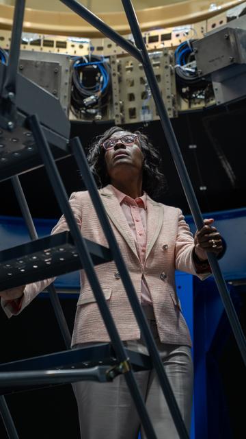 NASA image: Lakiesha Hawkins Climbs into the Payload Adapter Test Article